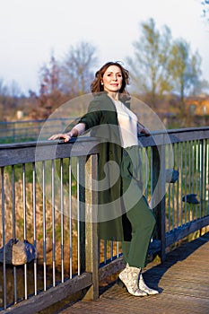 portrait of middle aged woman posing at the park