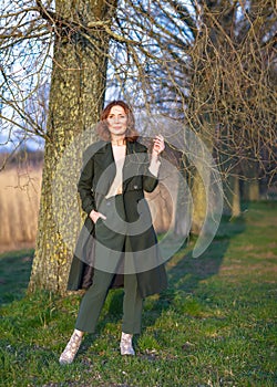 portrait of middle aged woman posing at the park