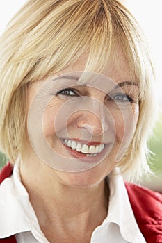 Portrait Of Middle Aged Woman Smiling At Camera