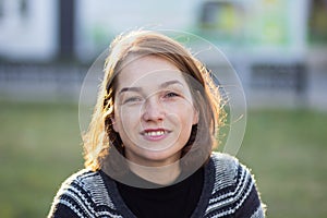 Portrait of middle aged woman in the summer park