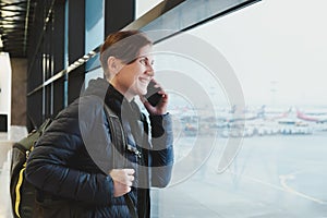Portrait of middle-aged woman talking on mobile phone