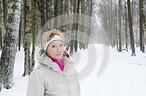 Portrait of a middle-aged woman of a winter alley
