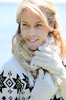 Portrait of middle-aged woman in winter clothes collection