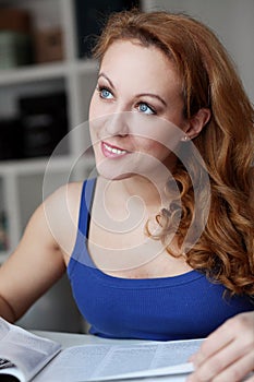 Portrait of middleaged happy woman with journal