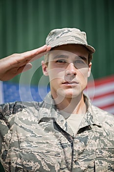 Portrait of military soldier giving salute