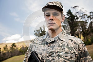 Portrait of military soldier guarding with a rifle