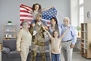 Portrait of happy American soldier in camouflage uniform together with his family