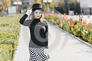 Portrait of a mime comedian. mime girl on the street