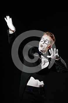 Portrait of mime man on black background