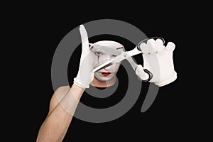 Portrait of mime with scissors