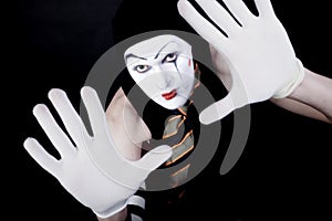 Portrait of mime in white gloves