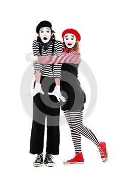 Portrait of mimes. happy woman embracing man