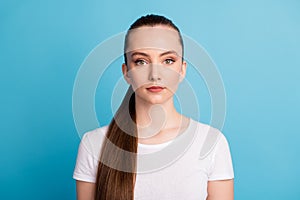 Portrait of minded reliable smart girl look in camera wear casual style outfit isolated over blue color background