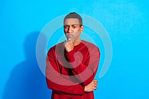 Portrait of minded young man hand touch chin contemplate hesitate decide isolated on blue color background