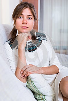 Portrait of miserable woman at home