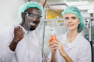 Portrait of mix race worker in food and drink factory happy worker together looking camera and smile