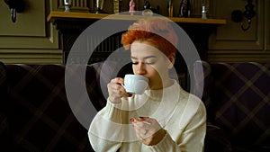 Portrait of mixed race woman posing in public cafe