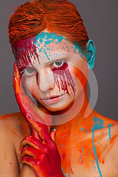 Portrait of a model in an expressive creative style using an unusual make-up