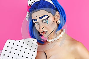 Portrait model makeup with blue wig, on pink, pop con