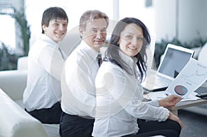 Portrait of modern business woman on the background of her workplace