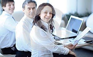 Portrait of modern business woman on the background of her workplace