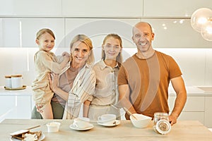 Portrait of Modern Family in Kitchen