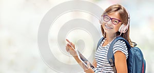 Portrait of modern happy teen school girl with bag backpack head