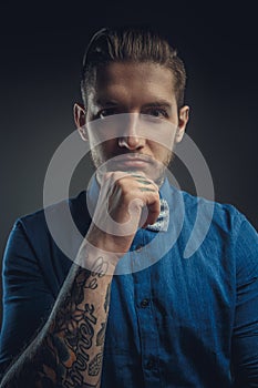 Portrait of modern male in blue shirt.