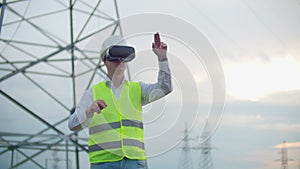 Portrait of a modern man of the comptroller of the engineer conducting the inspection via virtual reality glasses and a