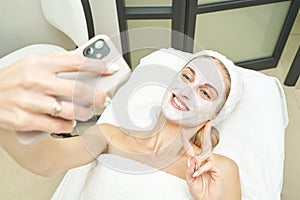 Portrait of moisturizing clay mask for medical design. Woman skin procedure.