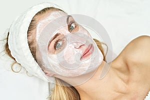 Portrait of moisturizing clay mask for medical design. Woman skin procedure.