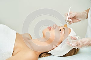 Portrait of moisturizing mask. Healthcare peeling cream photo