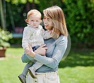 Portrait, mom and baby boy in backyard with smile, bonding and wellness on green grass together on summer weekend. Happy
