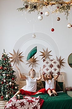 Portrait of mom and daughter in Christmas evening