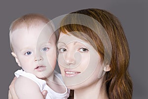 Portrait of mother with baby boy (1-2) studio shot