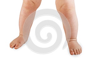 Portrait of mother and baby legs. First steps photo