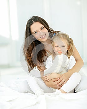 Portrait of mother and beloved little daughter.