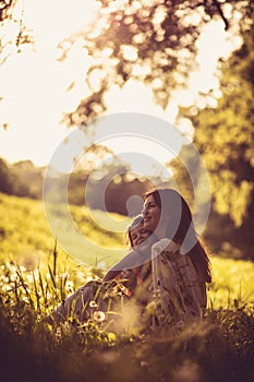 Portrait of mother and daughter in nature. Spring season.