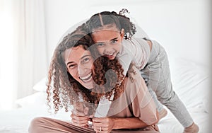 Portrait, mother and girl on bed, piggy back and smile with joy, bonding and quality time. Face, mama carry daughter or