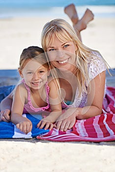 Portrait, mother and happy kid at beach to relax on holiday, summer or vacation on blanket. Face, mom and smile of girl