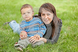 Portrait of a mother and her son outside