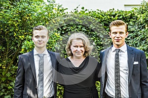 Portrait of mother with her two adolescent sons