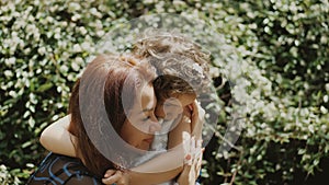 Portrait of a mother lovingly embracing her daughter. Happy mom and child daughter.