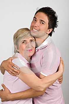 Portrait of mother and son hugging