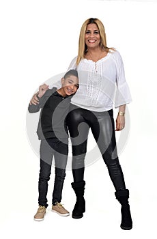 Portrait of a mother and son standing on white