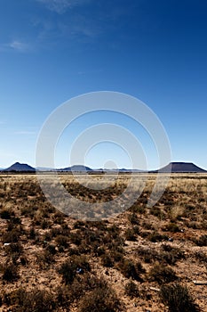 Portrait - Mountains with blue sky and yellow fields - Cradock photo