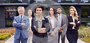 Portrait Of Multi-Cultural Business Team Outside Modern Office Building 