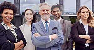 Portrait Of Multi-Cultural Business Team Outside Modern Office Building 