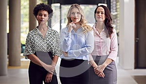 Portrait Of Multi-Cultural Female Business Team Inside Modern Office Building 