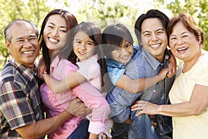 Portrait multi-generation Asian family in park